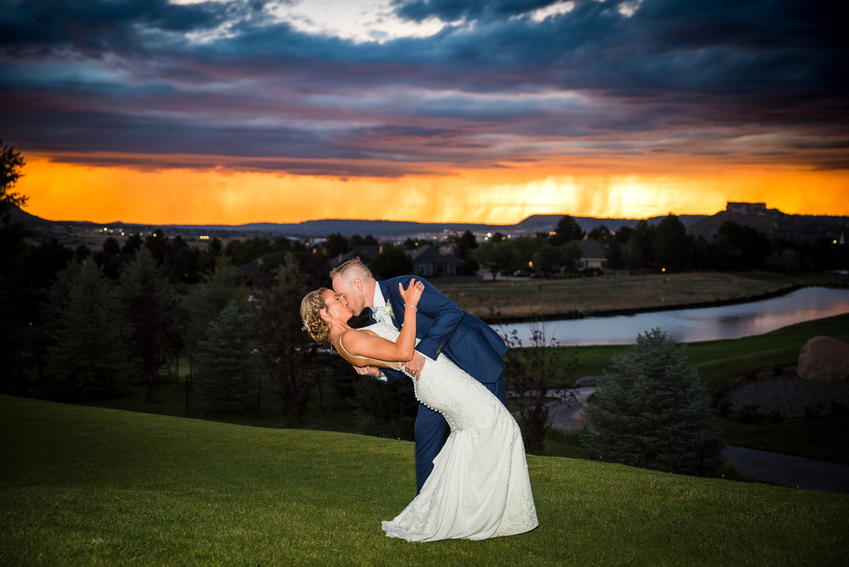 A bride and groom kiss at sunset, captured by Denver, Colorado wedding photographer Casey Van Horn.